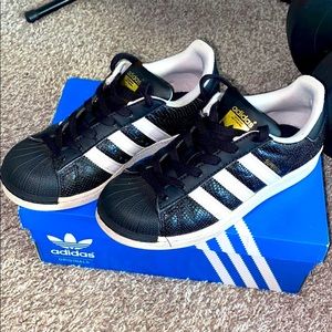 Adidas superstar reptile kids shoes.